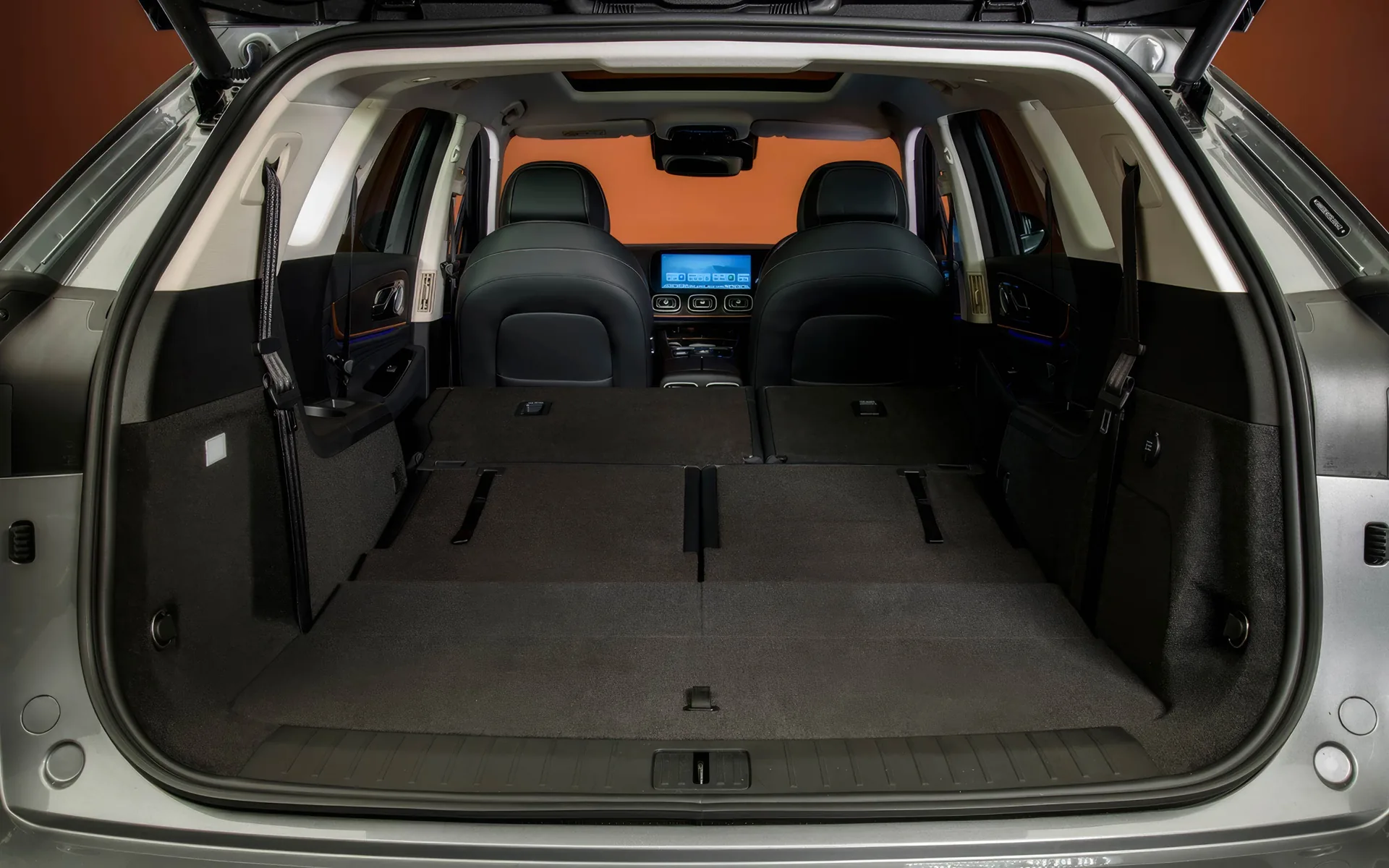 The JAECOO 8's boot open with the third row folded flat, second-row seats beyond