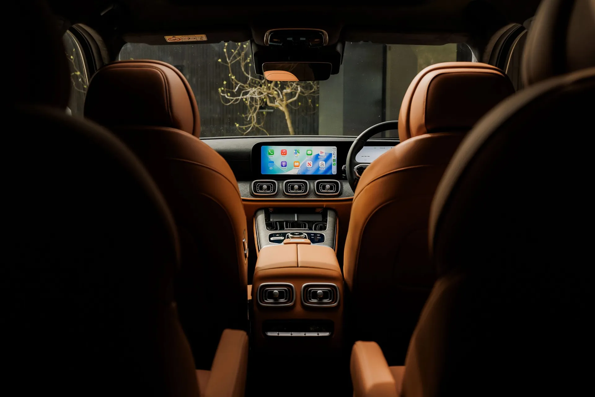 The cabin from the rear seats, trimmed in Cognac leather
